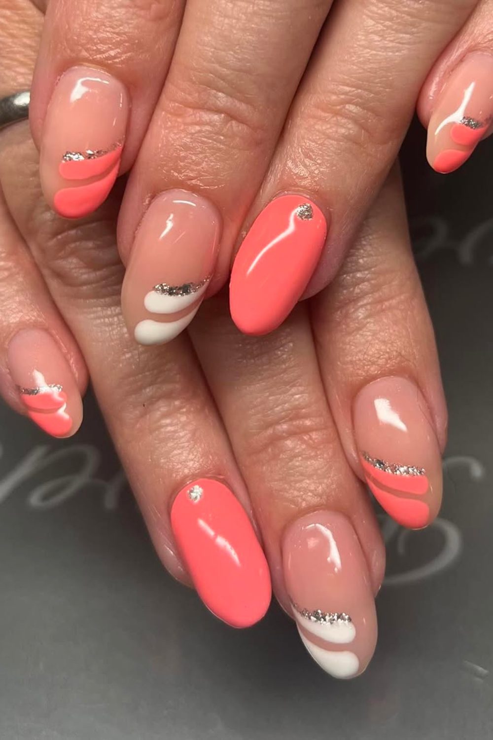 Short Spring Nail ideas - Coral Swirl – Playful Waves with a Touch of Sparkle