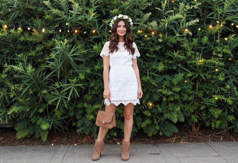 Woman in boho after-party outfit with lace mini dress and fringe boots