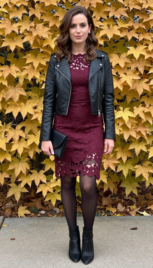 Burgundy lace high-low dress with black leather jacket and black ankle boots for a fall wedding guest outfit.