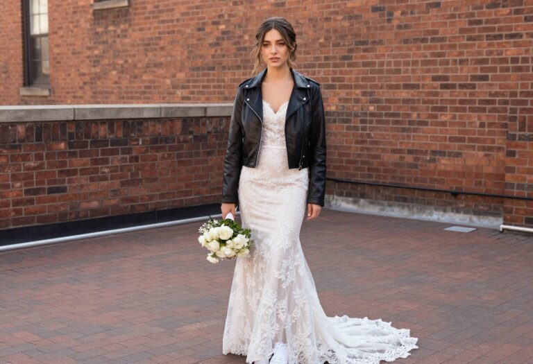 Woman in mermaid wedding dress with leather jacket and sneakers