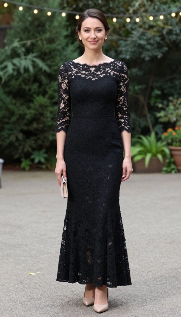 Woman in black lace fit-and-flare dress with nude pumps and clutch at garden wedding with string lights