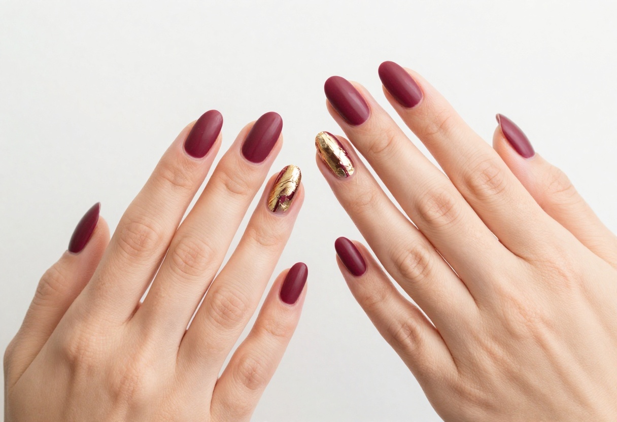 Matte merlot nails with gold foil accents for fall