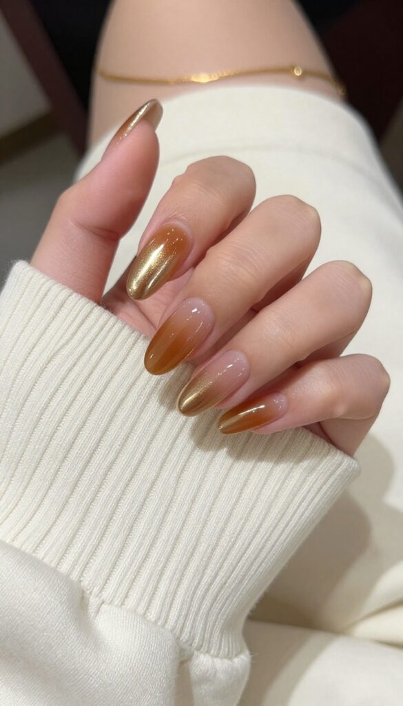 Glazed donut nails with a fall twist on almond shaped nails