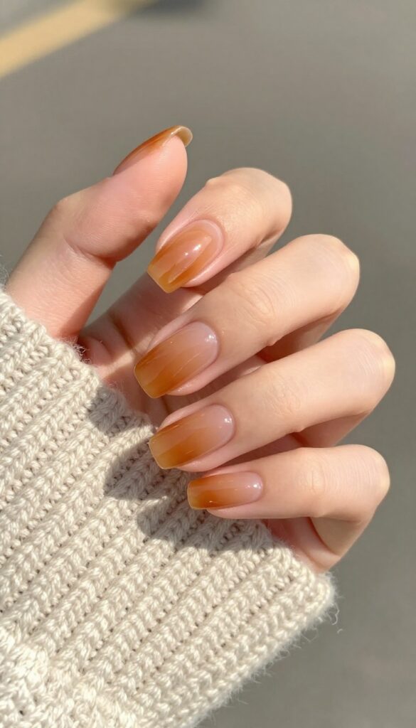 Maple syrup glazed nails with sheer amber jelly polish and glossy finish