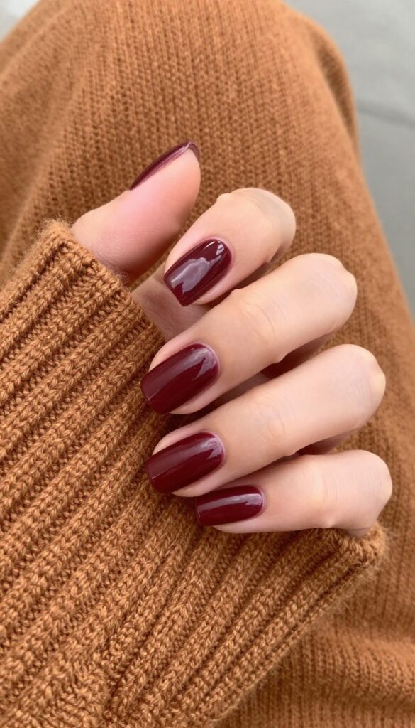 Square medium nails in classic burgundy crème polish