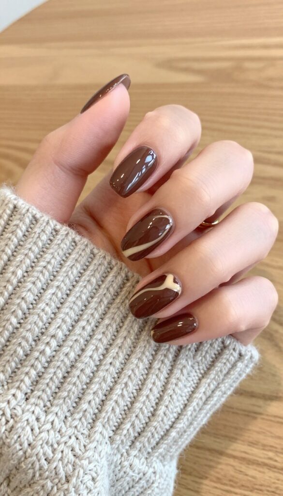Chocolate marble swirl nail design on almond-shaped nails