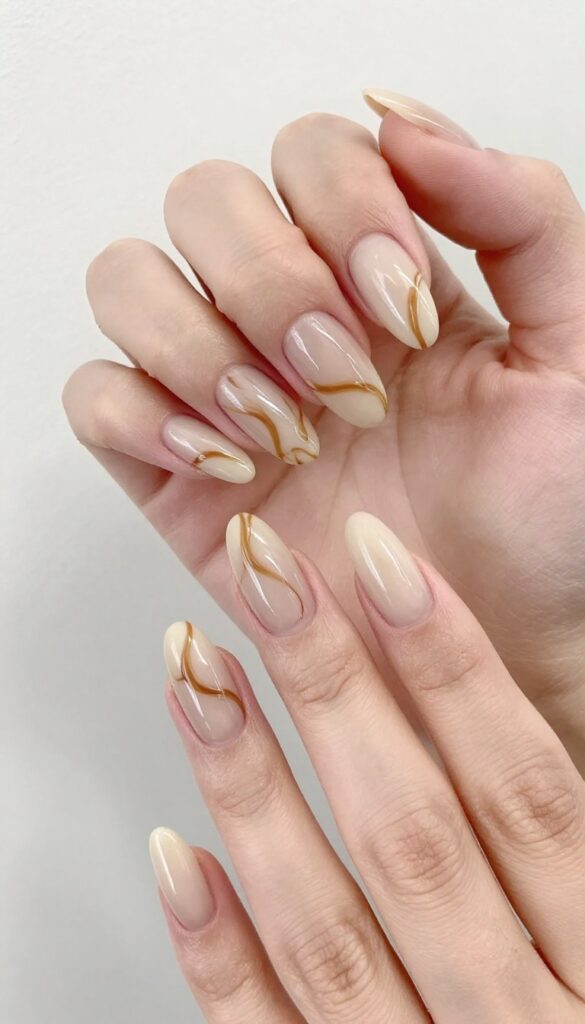 Almond nails with iced latte swirl design