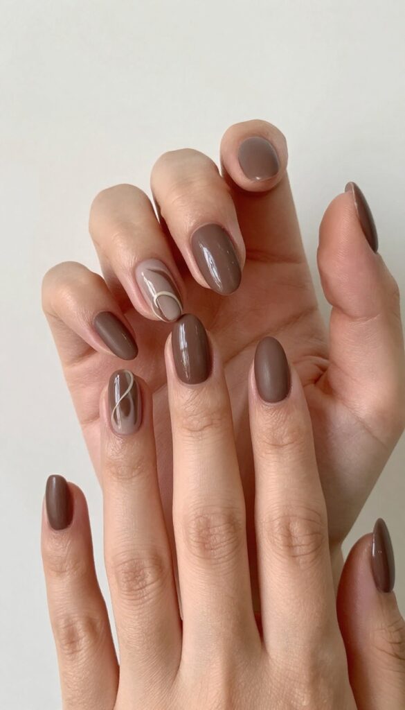 Almond nails with matte espresso brown and creamy latte swirls