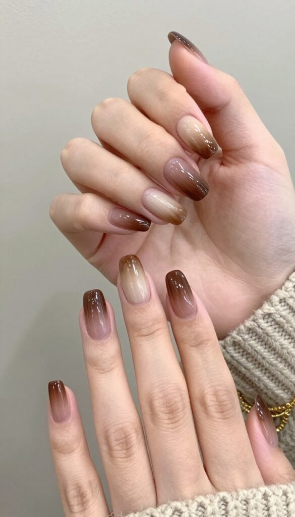 Mocha swirl ombré nails with almond shape and glossy finish
