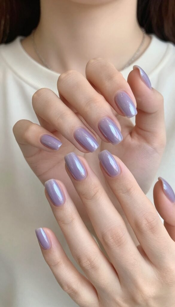 Iced lavender chrome nails on almond-shaped nails with glossy mirror finish