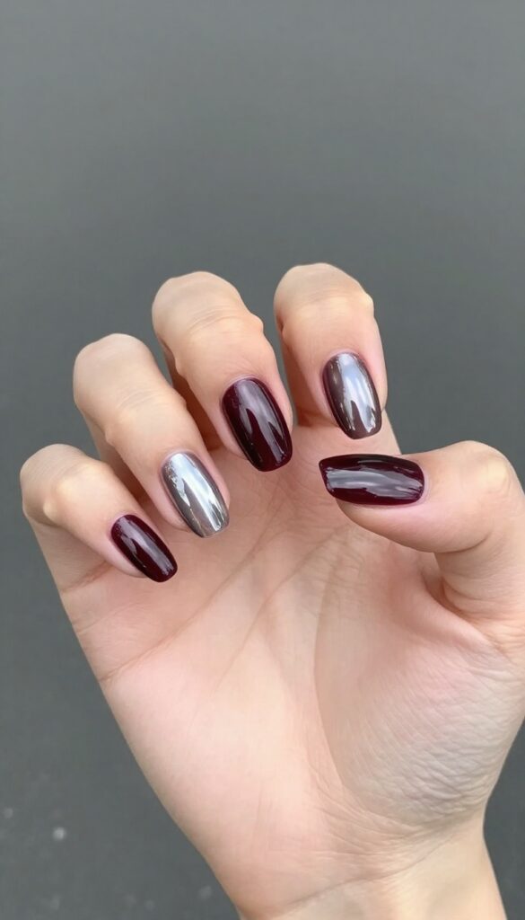 Midnight plum chrome nails with almond shape and mirror finish