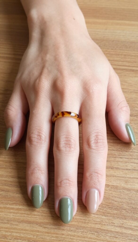 Olive green nails with tortoiseshell accent on almond shape
