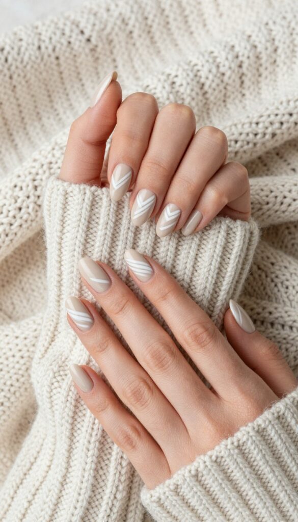 Sweater weather nails with creamy oatmeal base and matte white knit pattern stripes