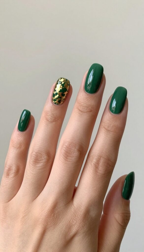 Hunting green nails with gold leaf accents, autumn manicure
