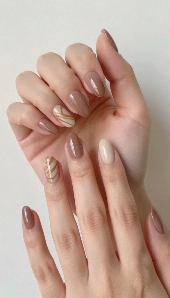 Chocolate swirl accent nail design on almond-shaped nails