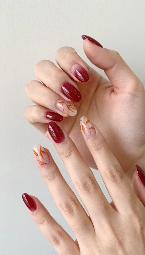 Cranberry orange swirl acrylic nails with glossy finish