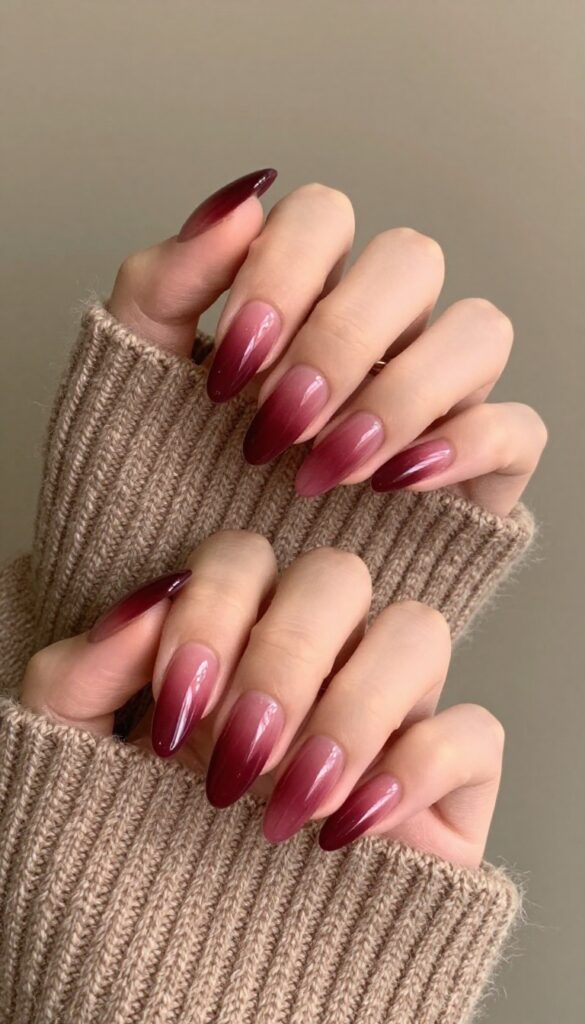 Burgundy gradient nails with almond shape and glossy finish