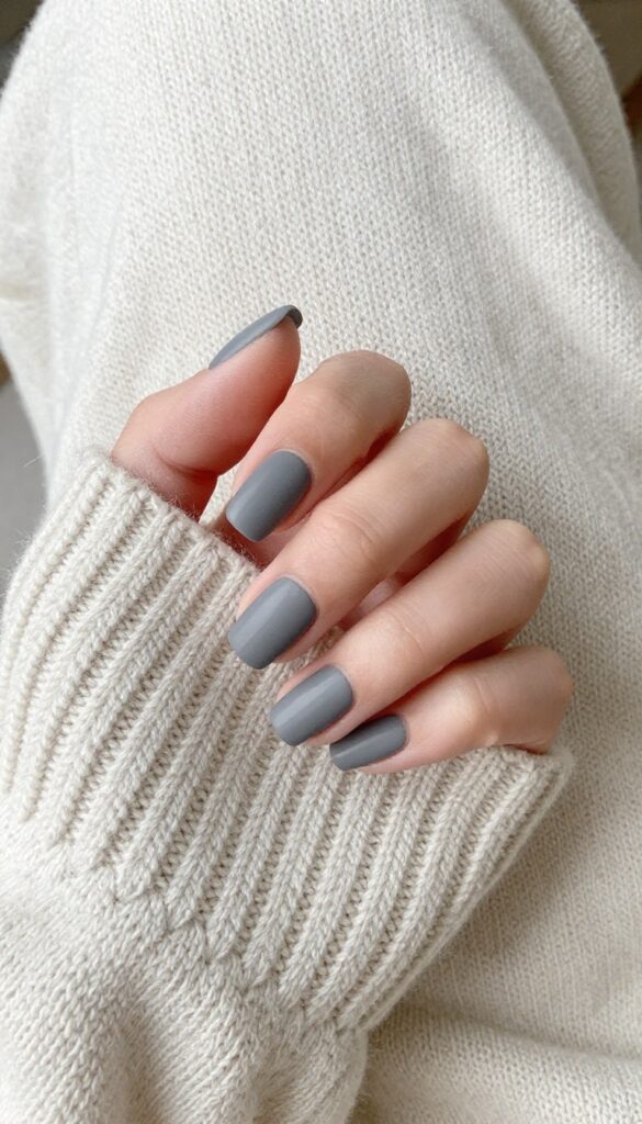 Smoky grey matte nails with tapered square shape on a woman's hand