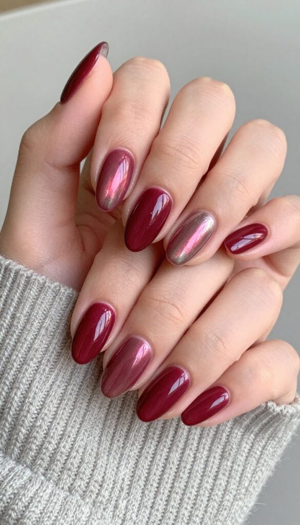 Cranberry chrome almond nails with high-shine metallic finish