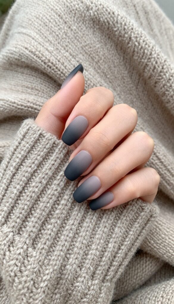Charcoal smokey gradient nails with matte finish on almond shape