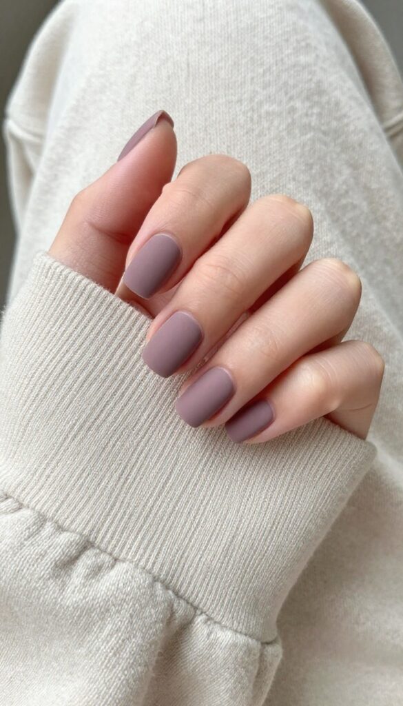 Short square nails in muted mauve with velvet matte finish