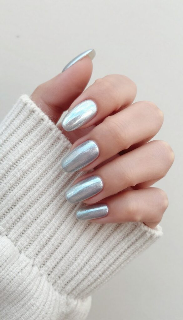 Icy silver chrome nails with frosty finish on almond shape