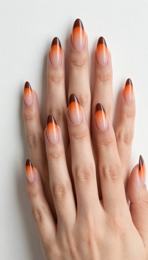 Burnt orange stiletto nails with brown tips gradient